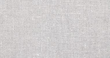 Natural Linen Material Textile Canvas Fabric Texture Background Close-up Detail of Fabric Natural Color Hemp Material Pattern Design Wallpaper. Can be Used as Background or For Graphic Design photo
