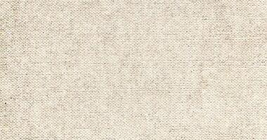 Natural Linen Material Textile Canvas Fabric Texture Background Close-up Detail of Fabric Natural Color Hemp Material Pattern Design Wallpaper. Can be Used as Background or For Graphic Design photo