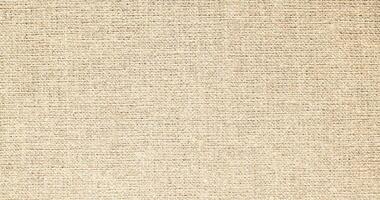 Natural Linen Material Textile Canvas Fabric Texture Background Close-up Detail of Fabric Natural Color Hemp Material Pattern Design Wallpaper. Can be Used as Background or For Graphic Design photo