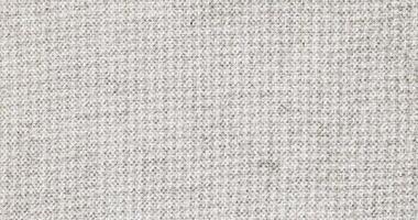 Natural Linen Material Textile Canvas Fabric Texture Background Close-up Detail of Fabric Natural Color Hemp Material Pattern Design Wallpaper. Can be Used as Background or For Graphic Design photo