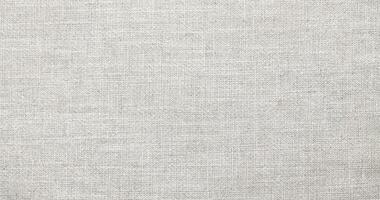 Natural Linen Material Textile Canvas Fabric Texture Background Close-up Detail of Fabric Natural Color Hemp Material Pattern Design Wallpaper. Can be Used as Background or For Graphic Design photo