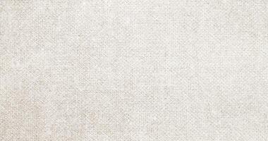 Natural Linen Material Textile Canvas Fabric Texture Background Close-up Detail of Fabric Natural Color Hemp Material Pattern Design Wallpaper. Can be Used as Background or For Graphic Design photo