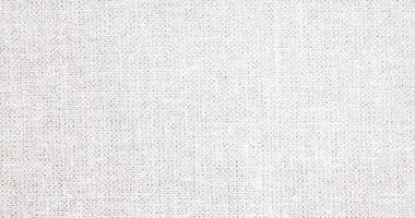 Natural Linen Material Textile Canvas Fabric Texture Background Close-up Detail of Fabric Natural Color Hemp Material Pattern Design Wallpaper. Can be Used as Background or For Graphic Design photo