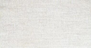 Natural Linen Material Textile Canvas Fabric Texture Background Close-up Detail of Fabric Natural Color Hemp Material Pattern Design Wallpaper. Can be Used as Background or For Graphic Design photo