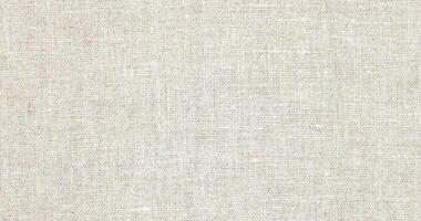 Natural Linen Material Textile Canvas Fabric Texture Background Close-up Detail of Fabric Natural Color Hemp Material Pattern Design Wallpaper. Can be Used as Background or For Graphic Design photo