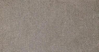 Natural Linen Material Textile Canvas Fabric Texture Background Close-up Detail of Fabric Natural Color Hemp Material Pattern Design Wallpaper. Can be Used as Background or For Graphic Design photo