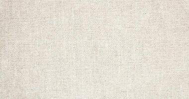 Natural Linen Material Textile Canvas Fabric Texture Background Close-up Detail of Fabric Natural Color Hemp Material Pattern Design Wallpaper. Can be Used as Background or For Graphic Design photo