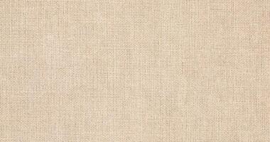 Natural Linen Material Textile Canvas Fabric Texture Background Close-up Detail of Fabric Natural Color Hemp Material Pattern Design Wallpaper. Can be Used as Background or For Graphic Design photo