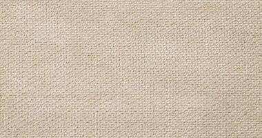 Natural Linen Material Textile Canvas Fabric Texture Background Close-up Detail of Fabric Natural Color Hemp Material Pattern Design Wallpaper. Can be Used as Background or For Graphic Design photo
