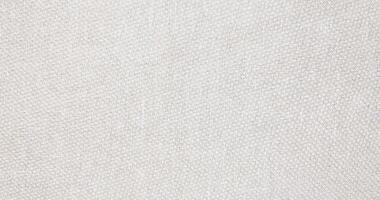 Natural Linen Material Textile Canvas Fabric Texture Background Close-up Detail of Fabric Natural Color Hemp Material Pattern Design Wallpaper. Can be Used as Background or For Graphic Design photo