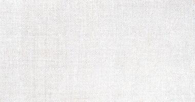 Natural Linen Material Textile Canvas Fabric Texture Background Close-up Detail of Fabric Natural Color Hemp Material Pattern Design Wallpaper. Can be Used as Background or For Graphic Design photo