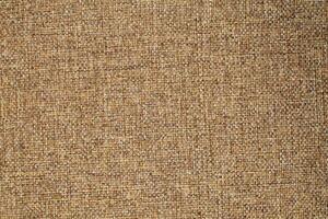 Natural Linen Material Textile Canvas Fabric Texture Background Close-up Detail of Fabric Natural Color Hemp Material Pattern Design Wallpaper. Can be Used as Background or For Graphic Design photo