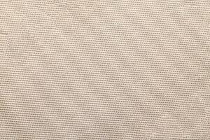 Natural Linen Material Textile Canvas Fabric Texture Background Close-up Detail of Fabric Natural Color Hemp Material Pattern Design Wallpaper. Can be Used as Background or For Graphic Design photo