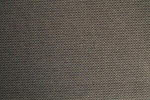 Natural Linen Material Textile Canvas Fabric Texture Background Close-up Detail of Fabric Natural Color Hemp Material Pattern Design Wallpaper. Can be Used as Background or For Graphic Design photo