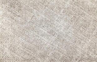 Natural Linen Material Textile Canvas Fabric Texture Background Close-up Detail of Fabric Natural Color Hemp Material Pattern Design Wallpaper. Can be Used as Background or For Graphic Design photo