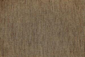 Natural Linen Material Textile Canvas Fabric Texture Background Close-up Detail of Fabric Natural Color Hemp Material Pattern Design Wallpaper. Can be Used as Background or For Graphic Design photo