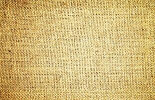 Natural Linen Material Textile Canvas Fabric Texture Background Close-up Detail of Fabric Natural Color Hemp Material Pattern Design Wallpaper. Can be Used as Background or For Graphic Design photo