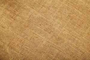 Natural Linen Material Textile Canvas Fabric Texture Background Close-up Detail of Fabric Natural Color Hemp Material Pattern Design Wallpaper. Can be Used as Background or For Graphic Design photo
