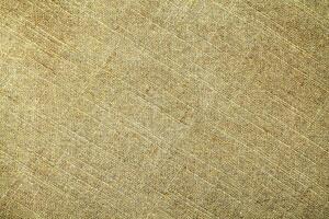 Natural Linen Material Textile Canvas Fabric Texture Background Close-up Detail of Fabric Natural Color Hemp Material Pattern Design Wallpaper. Can be Used as Background or For Graphic Design photo