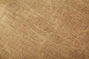 Natural Linen Material Textile Canvas Fabric Texture Background Close-up Detail of Fabric Natural Color Hemp Material Pattern Design Wallpaper. Can be Used as Background or For Graphic Design photo