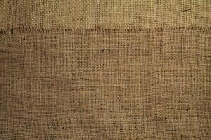 Natural Linen Material Textile Canvas Fabric Texture Background Close-up Detail of Fabric Natural Color Hemp Material Pattern Design Wallpaper. Can be Used as Background or For Graphic Design photo
