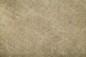 Natural Linen Material Textile Canvas Fabric Texture Background Close-up Detail of Fabric Natural Color Hemp Material Pattern Design Wallpaper. Can be Used as Background or For Graphic Design photo