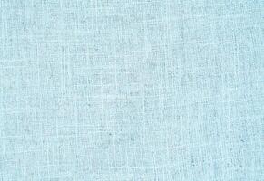 Natural Linen Material Textile Canvas Fabric Texture Background Close-up Detail of Fabric Natural Color Hemp Material Pattern Design Wallpaper. Can be Used as Background or For Graphic Design photo