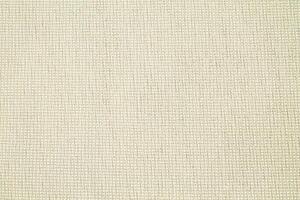Natural Linen Material Textile Canvas Fabric Texture Background Close-up Detail of Fabric Natural Color Hemp Material Pattern Design Wallpaper. Can be Used as Background or For Graphic Design photo