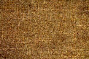 Natural Linen Material Textile Canvas Fabric Texture Background Close-up Detail of Fabric Natural Color Hemp Material Pattern Design Wallpaper. Can be Used as Background or For Graphic Design photo
