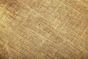 Natural Linen Material Textile Canvas Fabric Texture Background Close-up Detail of Fabric Natural Color Hemp Material Pattern Design Wallpaper. Can be Used as Background or For Graphic Design photo