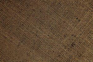 Natural Linen Material Textile Canvas Fabric Texture Background Close-up Detail of Fabric Natural Color Hemp Material Pattern Design Wallpaper. Can be Used as Background or For Graphic Design photo