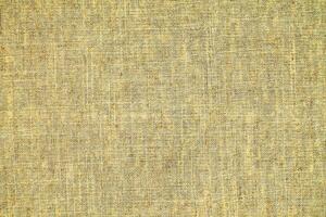 Natural Linen Material Textile Canvas Fabric Texture Background Close-up Detail of Fabric Natural Color Hemp Material Pattern Design Wallpaper. Can be Used as Background or For Graphic Design photo