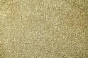 Natural Linen Material Textile Canvas Fabric Texture Background Close-up Detail of Fabric Natural Color Hemp Material Pattern Design Wallpaper. Can be Used as Background or For Graphic Design photo