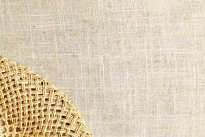 Natural Linen Material Textile Canvas Fabric Texture Background Close-up Detail of Fabric Natural Color Hemp Material Pattern Design Wallpaper. Can be Used as Background or For Graphic Design photo