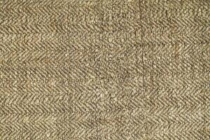 Natural Linen Material Textile Canvas Fabric Texture Background Close-up Detail of Fabric Natural Color Hemp Material Pattern Design Wallpaper. Can be Used as Background or For Graphic Design photo