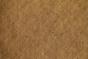 Natural Linen Material Textile Canvas Fabric Texture Background Close-up Detail of Fabric Natural Color Hemp Material Pattern Design Wallpaper. Can be Used as Background or For Graphic Design photo