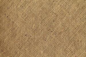 Natural Linen Material Textile Canvas Fabric Texture Background Close-up Detail of Fabric Natural Color Hemp Material Pattern Design Wallpaper. Can be Used as Background or For Graphic Design photo