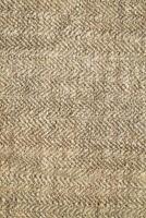 Natural Linen Material Textile Canvas Fabric Texture Background Close-up Detail of Fabric Natural Color Hemp Material Pattern Design Wallpaper. Can be Used as Background or For Graphic Design photo