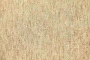 Natural Linen Material Textile Canvas Fabric Texture Background Close-up Detail of Fabric Natural Color Hemp Material Pattern Design Wallpaper. Can be Used as Background or For Graphic Design photo