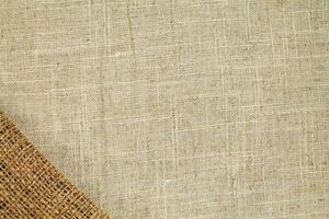 Natural Linen Material Textile Canvas Fabric Texture Background Close-up Detail of Fabric Natural Color Hemp Material Pattern Design Wallpaper. Can be Used as Background or For Graphic Design photo