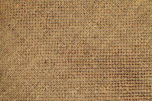 Natural Linen Material Textile Canvas Fabric Texture Background Close-up Detail of Fabric Natural Color Hemp Material Pattern Design Wallpaper. Can be Used as Background or For Graphic Design photo