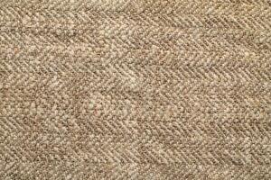 Natural Linen Material Textile Canvas Fabric Texture Background Close-up Detail of Fabric Natural Color Hemp Material Pattern Design Wallpaper. Can be Used as Background or For Graphic Design photo