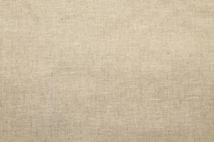 Natural Linen Material Textile Canvas Fabric Texture Background Close-up Detail of Fabric Natural Color Hemp Material Pattern Design Wallpaper. Can be Used as Background or For Graphic Design photo