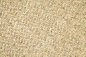 Natural Linen Material Textile Canvas Fabric Texture Background Close-up Detail of Fabric Natural Color Hemp Material Pattern Design Wallpaper. Can be Used as Background or For Graphic Design photo