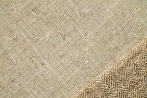 Natural Linen Material Textile Canvas Fabric Texture Background Close-up Detail of Fabric Natural Color Hemp Material Pattern Design Wallpaper. Can be Used as Background or For Graphic Design photo