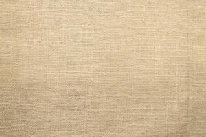 Natural Linen Material Textile Canvas Fabric Texture Background Close-up Detail of Fabric Natural Color Hemp Material Pattern Design Wallpaper. Can be Used as Background or For Graphic Design photo