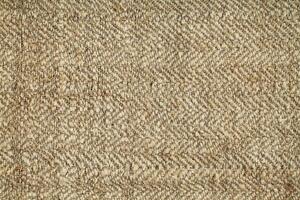 Natural Linen Material Textile Canvas Fabric Texture Background Close-up Detail of Fabric Natural Color Hemp Material Pattern Design Wallpaper. Can be Used as Background or For Graphic Design photo