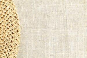 Natural Linen Material Textile Canvas Fabric Texture Background Close-up Detail of Fabric Natural Color Hemp Material Pattern Design Wallpaper. Can be Used as Background or For Graphic Design photo