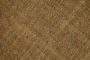 Natural Linen Material Textile Canvas Fabric Texture Background Close-up Detail of Fabric Natural Color Hemp Material Pattern Design Wallpaper. Can be Used as Background or For Graphic Design photo