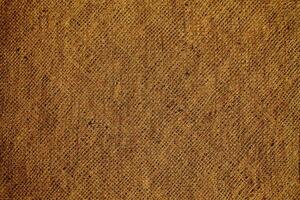 Natural Linen Material Textile Canvas Fabric Texture Background Close-up Detail of Fabric Natural Color Hemp Material Pattern Design Wallpaper. Can be Used as Background or For Graphic Design photo